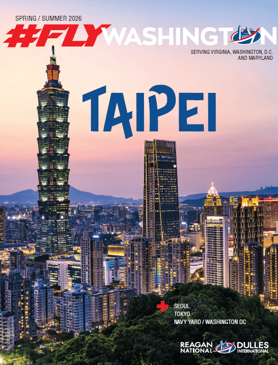 Cover of a magazine titled "#FlyWashington, Spring/Summer 2026". Features a cityscape of Taipei with illuminated skyscrapers, including Taipei 101. Text mentions "Seoul, Tokyo, Navy Yard". Logos for Reagan National and Dulles International are at the bottom.