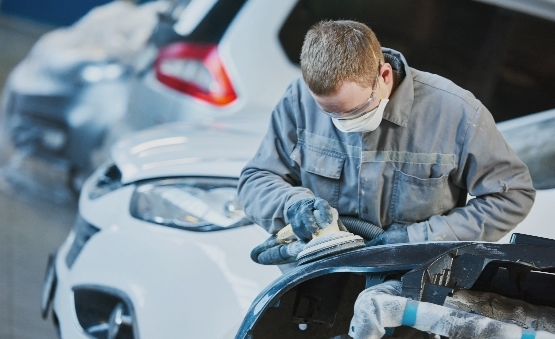 Technician Polishing the door