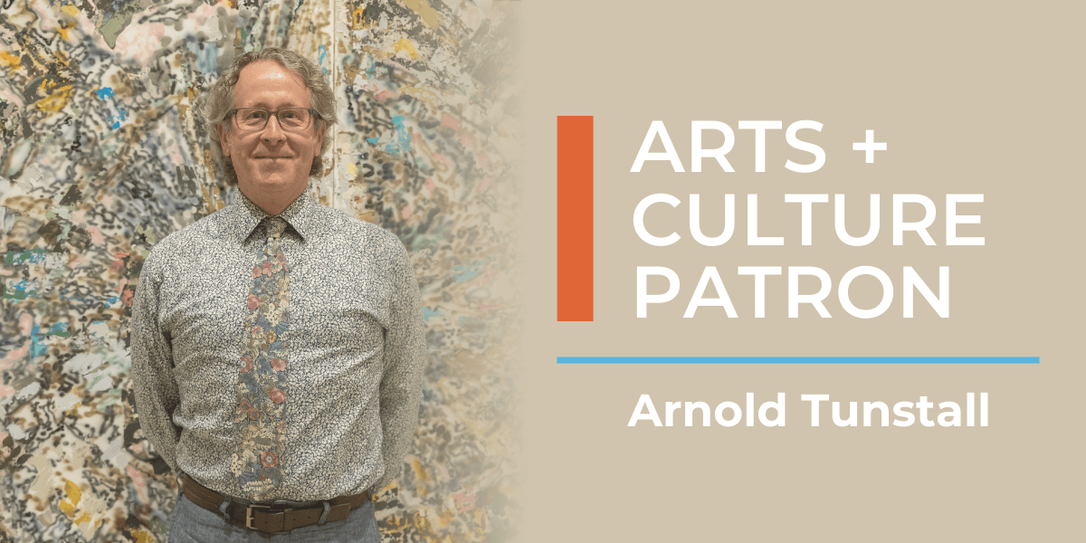 Tan graphic with a photo of man behind artwork to the left. To the right is white text that reads "Arts and Culture Patron, Arnold Tunstall." A blue and orange line are beside and underneath the text.