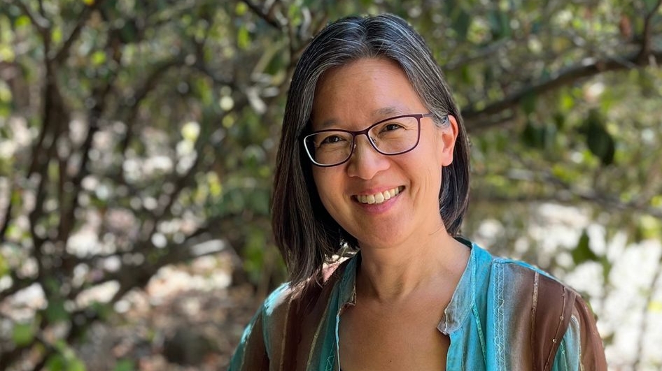 Photo of a woman smiling outdoors