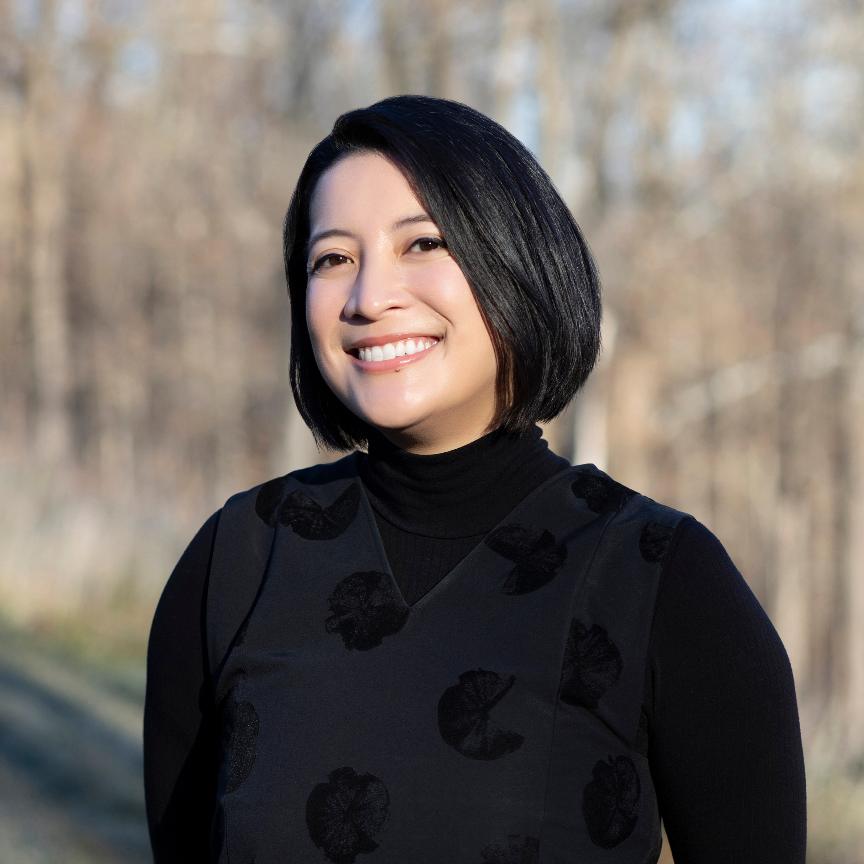 Woman smiling outside.